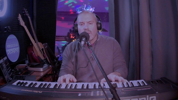 Photo of Brian Kelley of Ferocious Designs performs in his home studio.